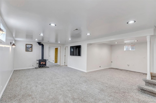 3630 W Saratoga Ave, Littleton, CO 80123 - basement featuring a wood stove, carpet flooring, and recessed lighting
