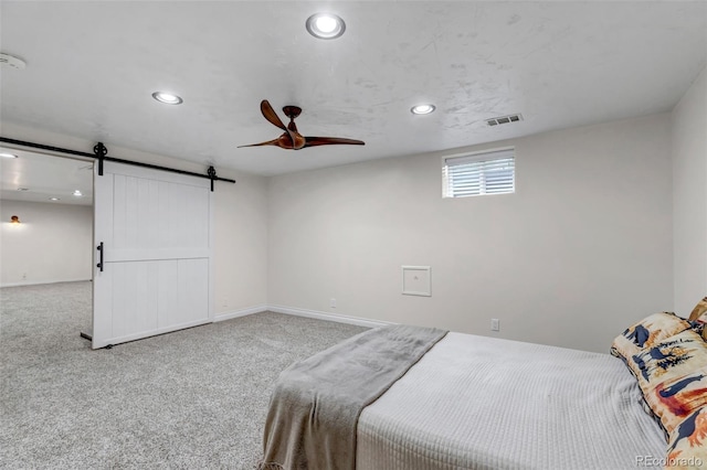 3630 W Saratoga Ave, Littleton, CO 80123 - carpeted bedroom with a barn door, recessed lighting, and ceiling fan