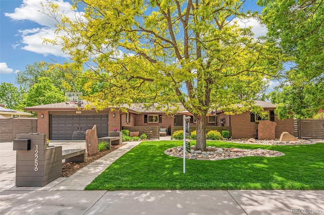 12256 W 34th Pl, Wheat Ridge, CO 80033 - single story home featuring an attached garage, brick siding, and driveway