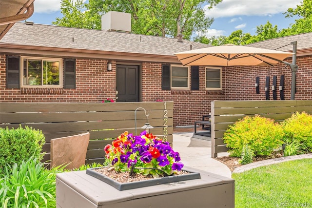 12256 W 34th Pl, Wheat Ridge, CO 80033 - view of front of property with brick siding, roof with shingles, and a chimney
