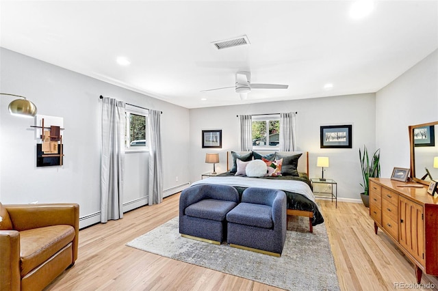 12256 W 34th Pl, Wheat Ridge, CO 80033 - bedroom featuring baseboard heating, light wood-style flooring, recessed lighting, and a ceiling fan