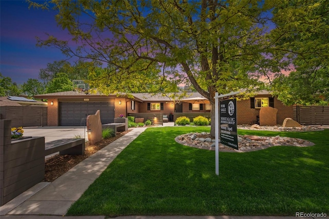 12256 W 34th Pl, Wheat Ridge, CO 80033 - ranch-style house with a garage, brick siding, and driveway