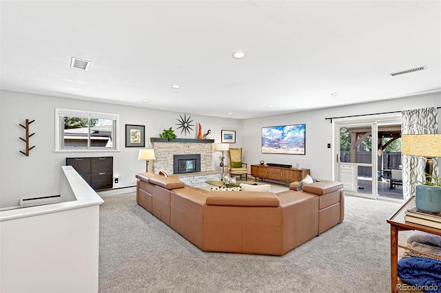 12256 W 34th Pl, Wheat Ridge, CO 80033 - living area featuring carpet, recessed lighting, baseboard heating, and a stone fireplace