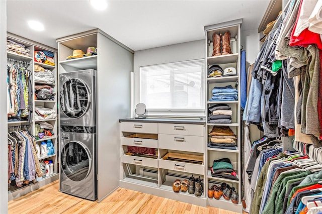12256 W 34th Pl, Wheat Ridge, CO 80033 - walk in closet with estacked washer and dryer and light wood-type flooring