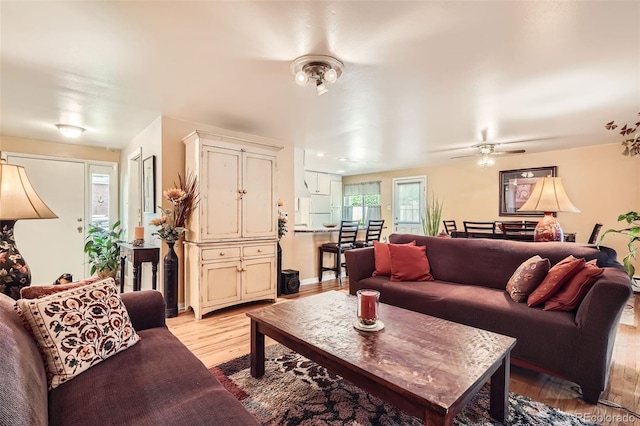 6940 W 63rd Ave, Arvada, CO 80003 - living area with light wood-type flooring and ceiling fan