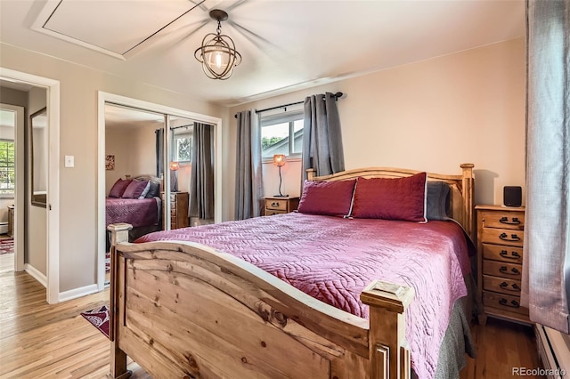 6940 W 63rd Ave, Arvada, CO 80003 - bedroom featuring light wood-style flooring and a closet