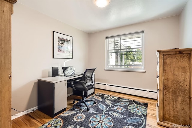 6940 W 63rd Ave, Arvada, CO 80003 - office with a baseboard heating unit and light wood-style floors