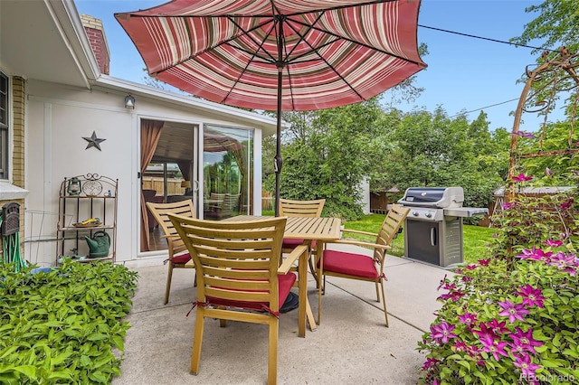 6940 W 63rd Ave, Arvada, CO 80003 - view of patio / terrace featuring a grill and outdoor dining space