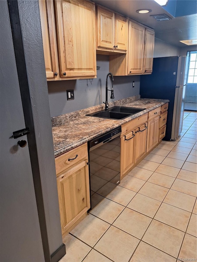 3550 S Harlan St Unit 313, Denver, CO 80235 - kitchen featuring black dishwasher, a sink, light brown cabinetry, light tile patterned floors, and dark stone countertops
