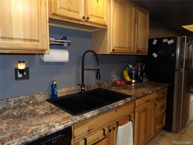 3550 S Harlan St Unit 313, Denver, CO 80235 - kitchen featuring a sink, light tile patterned floors, freestanding refrigerator, dishwasher, and dark stone countertops