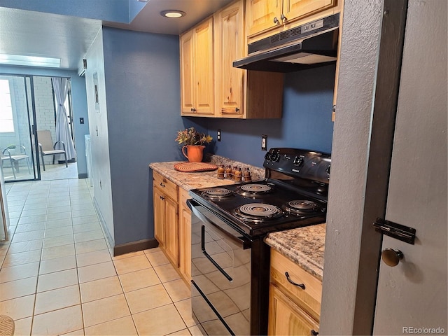 3550 S Harlan St Unit 313, Denver, CO 80235 - kitchen featuring black / electric stove, under cabinet range hood, light tile patterned flooring, baseboards, and light stone counters
