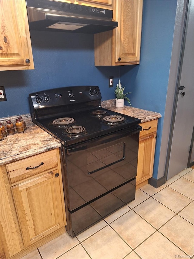 3550 S Harlan St Unit 313, Denver, CO 80235 - kitchen with electric range, under cabinet range hood, light brown cabinets, and light tile patterned floors