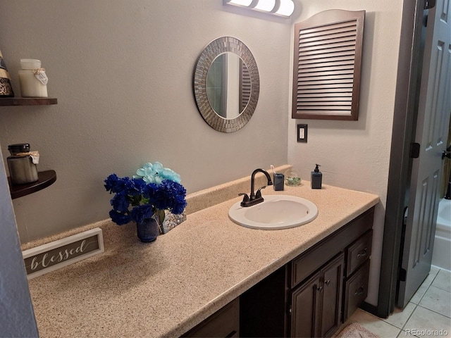 bathroom with vanity and tile patterned flooring