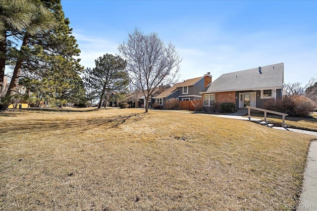 exterior space featuring a front yard and a chimney