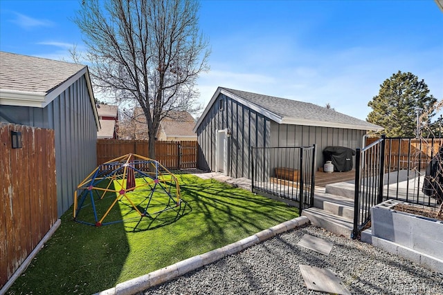 view of yard featuring a fenced backyard and a wooden deck