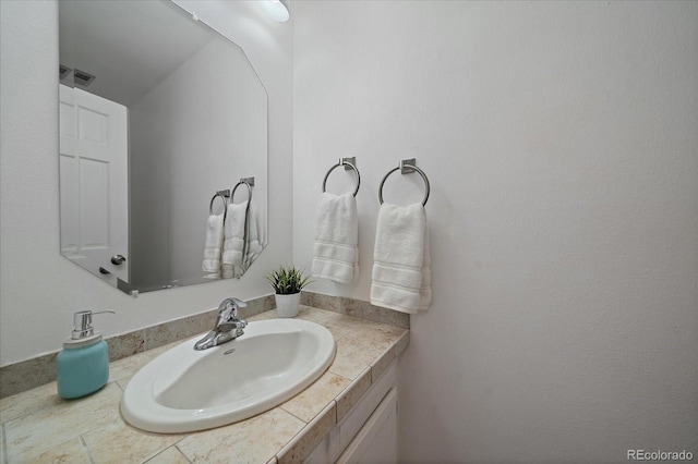 bathroom with visible vents and vanity