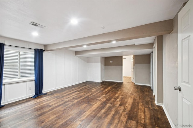 basement featuring dark hardwood / wood-style flooring