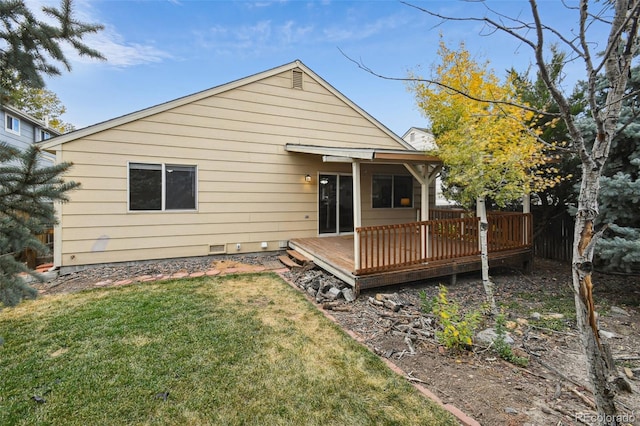 back of property featuring a yard and a deck