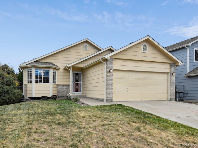 ranch-style home featuring a garage and a front lawn