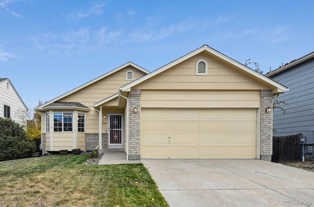 single story home featuring a garage and a front yard