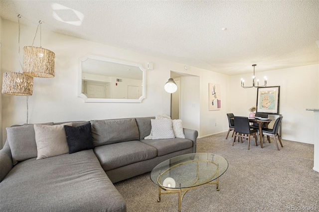 carpeted living room featuring a chandelier and a textured ceiling