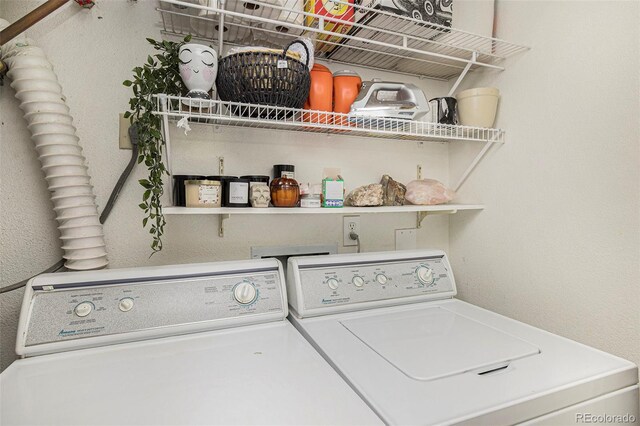 washroom with washing machine and dryer