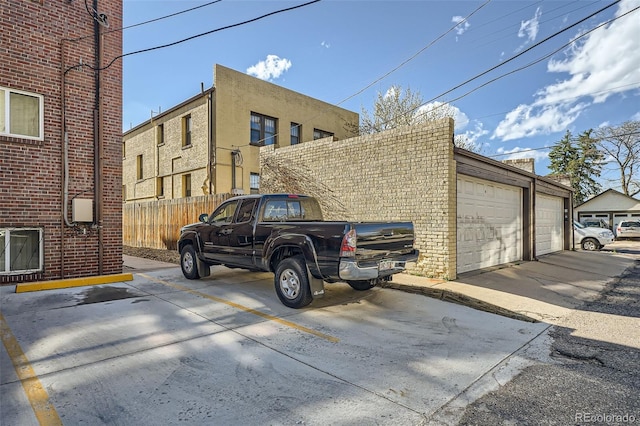 view of home's exterior featuring fence and brick siding