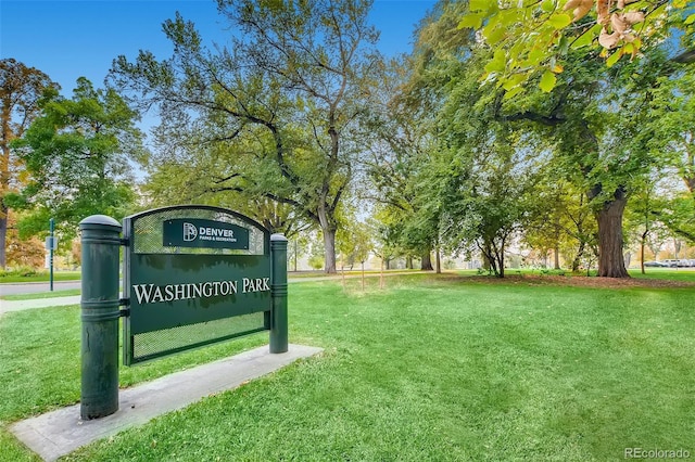 community sign featuring a lawn