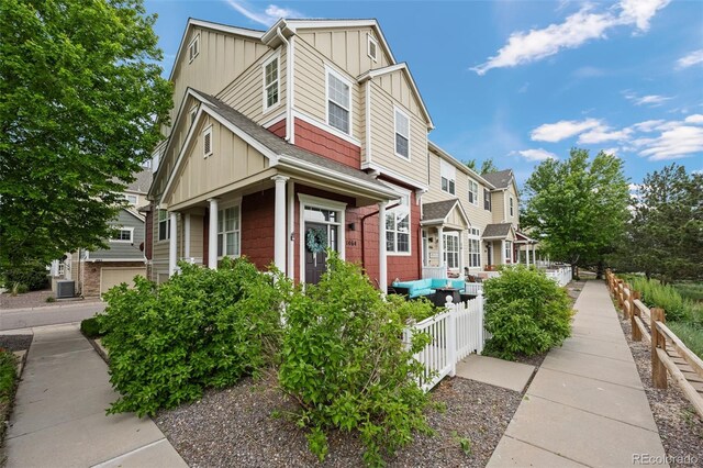 1464 Nemrick Pl, Castle Rock, CO 80109 - view of front of house featuring board and batten siding and cooling unit