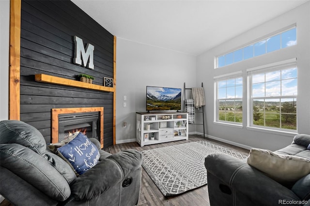 1464 Nemrick Pl, Castle Rock, CO 80109 - living area featuring wood finished floors, healthy amount of natural light, and baseboards