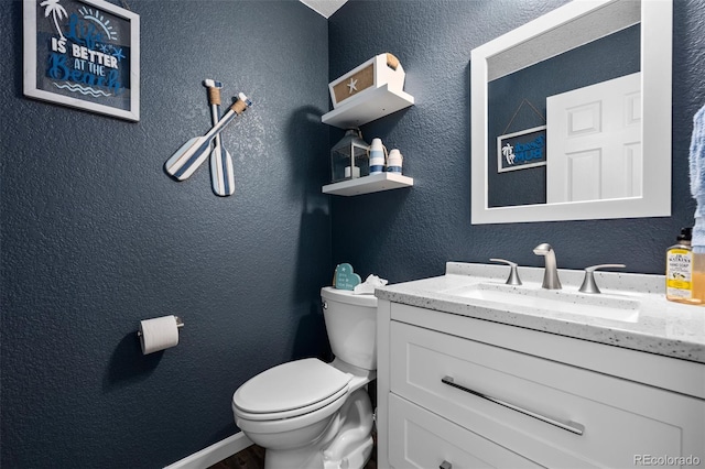 1464 Nemrick Pl, Castle Rock, CO 80109 - half bathroom featuring vanity, toilet, a textured wall, and wood finished floors