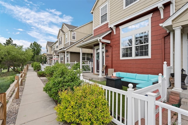 1464 Nemrick Pl, Castle Rock, CO 80109 - view of side of home with an outdoor living space with a fire pit