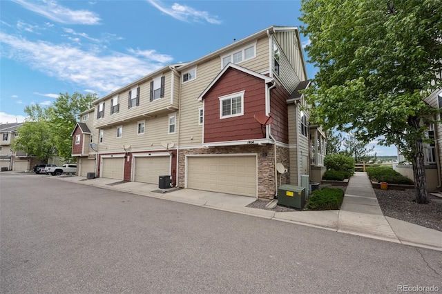 1464 Nemrick Pl, Castle Rock, CO 80109 - multi unit property with stone siding, central air condition unit, and a garage