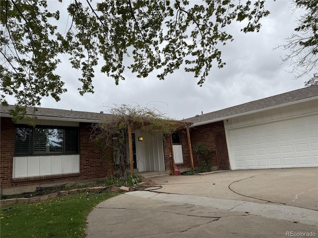 8895 E Radcliff Ave E, Denver, CO 80237 - ranch-style house featuring brick siding, concrete driveway, and an attached garage