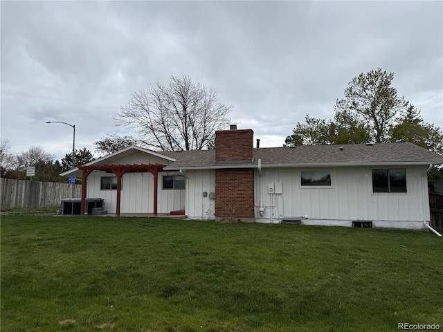 8895 E Radcliff Ave E, Denver, CO 80237 - rear view of property with a chimney, roof with shingles, board and batten siding, and central AC