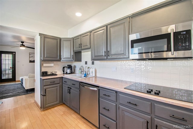 8895 E Radcliff Ave E, Denver, CO 80237 - kitchen featuring gray cabinetry, appliances with stainless steel finishes, a sink, ceiling fan, and light countertops