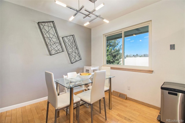 8895 E Radcliff Ave E, Denver, CO 80237 - dining space with light wood-style flooring and baseboards