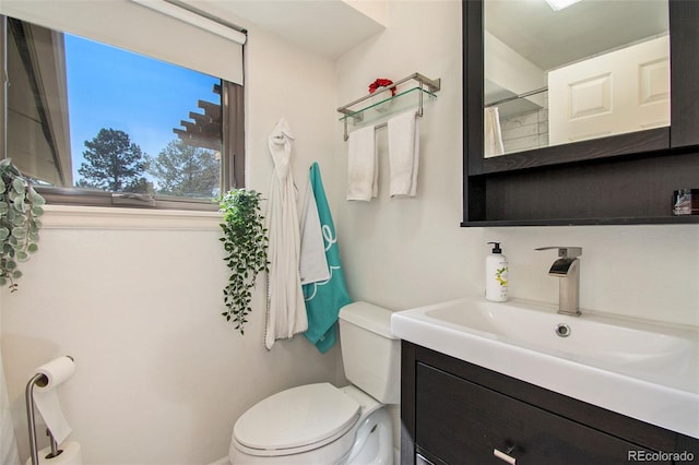 8895 E Radcliff Ave E, Denver, CO 80237 - full bathroom featuring toilet, vanity, and a shower with shower curtain