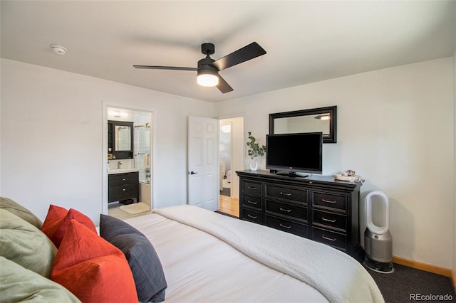 8895 E Radcliff Ave E, Denver, CO 80237 - bedroom featuring baseboards, connected bathroom, light carpet, and a ceiling fan