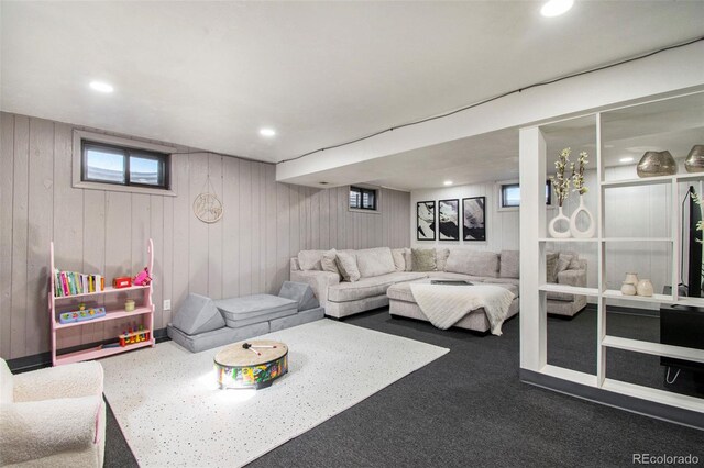 8895 E Radcliff Ave E, Denver, CO 80237 - carpeted living room featuring wood walls and recessed lighting