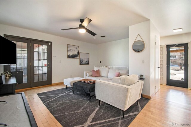 8895 E Radcliff Ave E, Denver, CO 80237 - living room featuring plenty of natural light, hardwood / wood-style flooring, and a ceiling fan