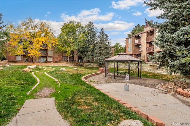 view of community featuring a gazebo and a yard