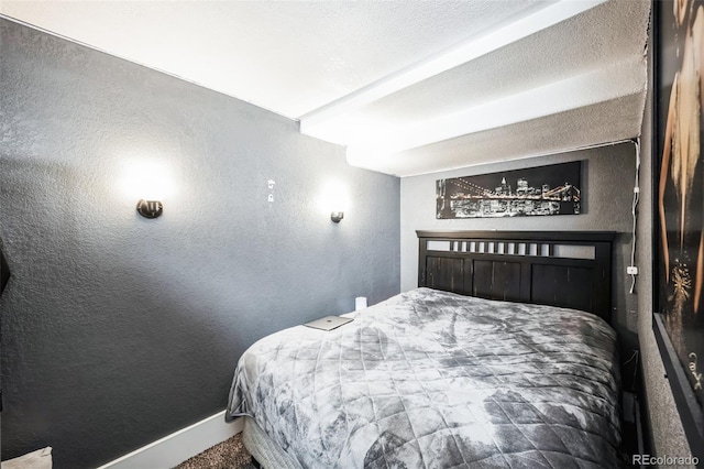 327 N 12th Ave, Brighton, CO 80601 - carpeted bedroom featuring a textured wall and baseboards