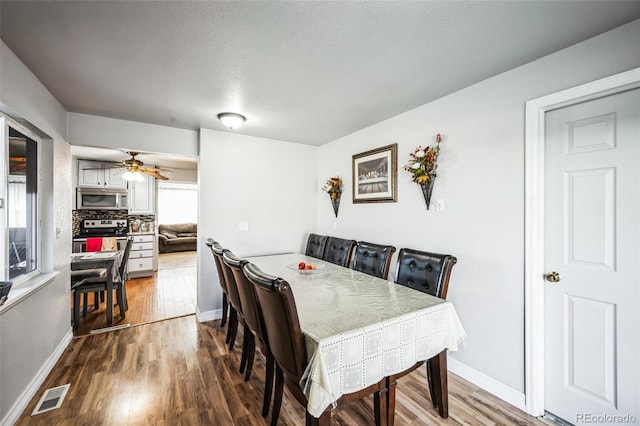 327 N 12th Ave, Brighton, CO 80601 - dining room with dark wood-style floors and a ceiling fan