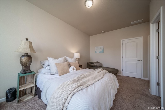 bedroom featuring carpet and baseboards