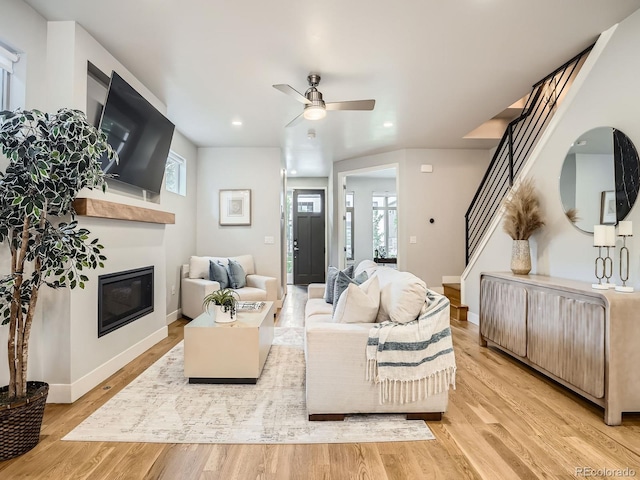 4535 Stuart St, Denver, CO 80212 - living area with a glass covered fireplace, stairway, light wood-type flooring, ceiling fan, and recessed lighting