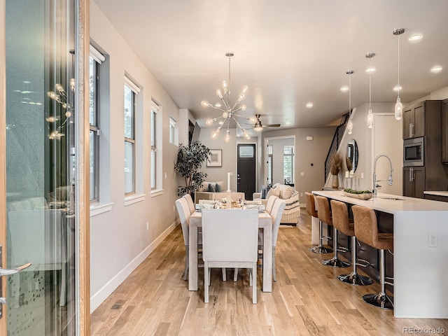 4535 Stuart St, Denver, CO 80212 - dining space featuring a chandelier, light wood-style floors, and recessed lighting