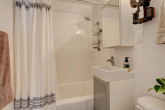 bathroom with vanity, toilet, and shower / tub combo