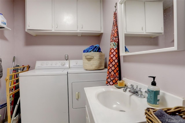 laundry area featuring a sink and washer and clothes dryer