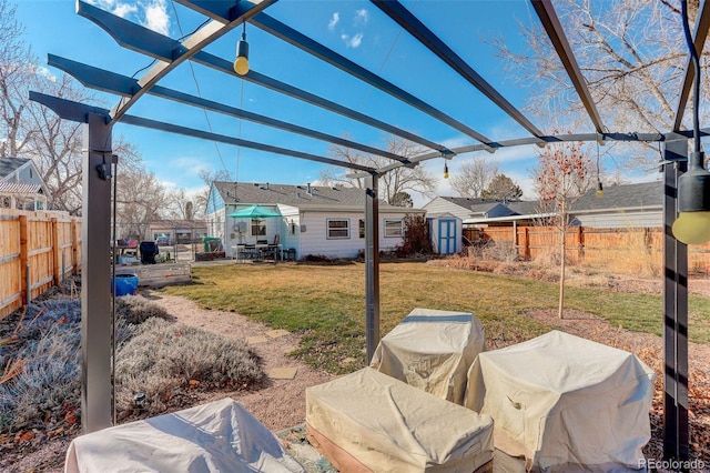 view of yard with a fenced backyard and a pergola